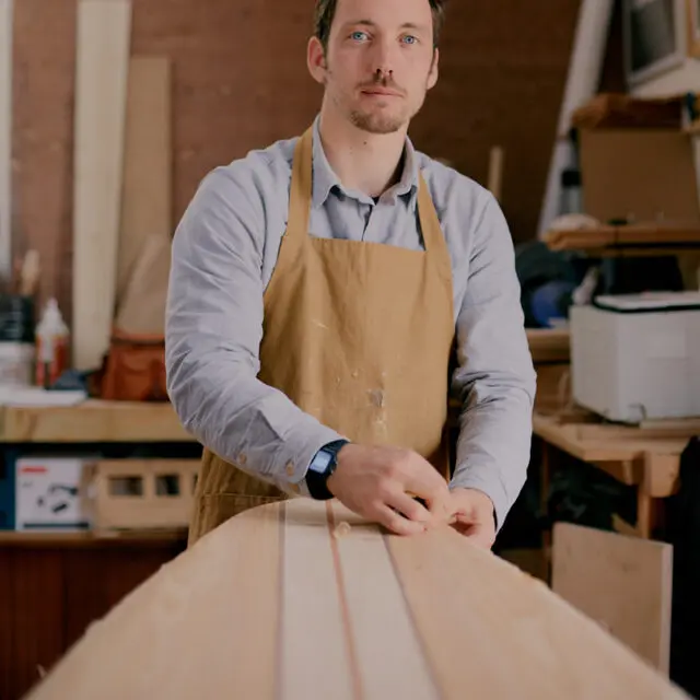 Profile photo of James Otter in his shaping bay