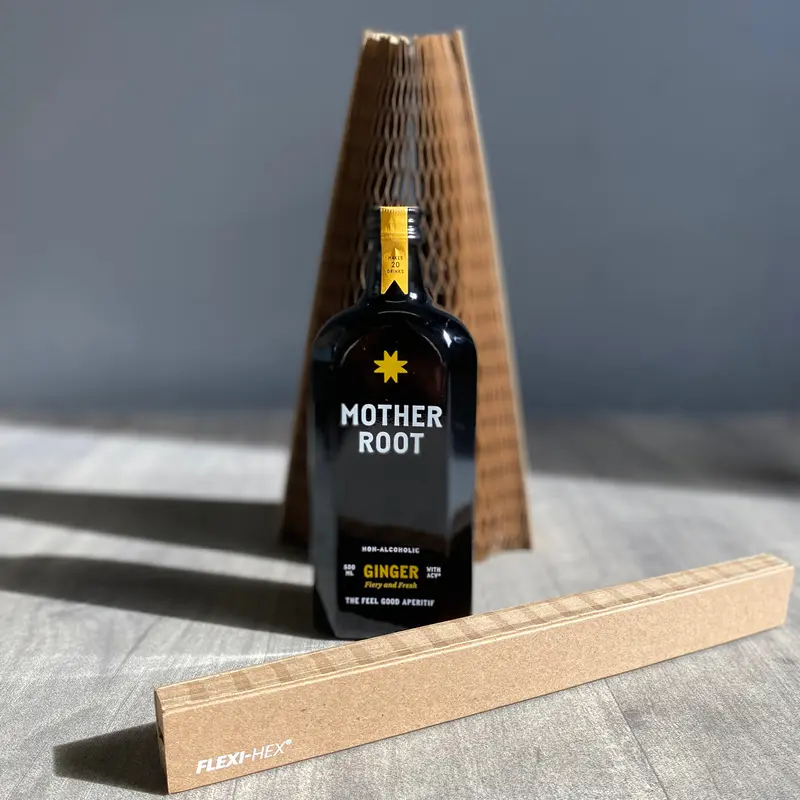A bottle of Mother Root non-alcoholic ginger drink on Dragons Den protected with Flexi-Hex honeycomb plastic-free packaging